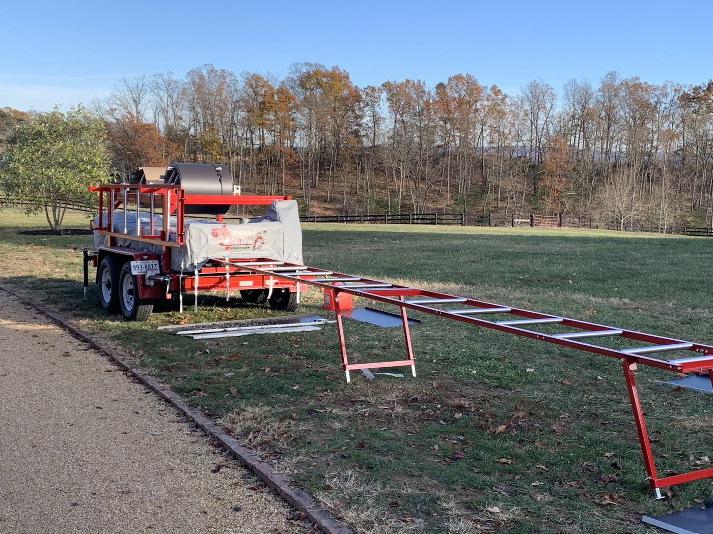 jobsite standing seam panel machine running custom length metal roofing panels